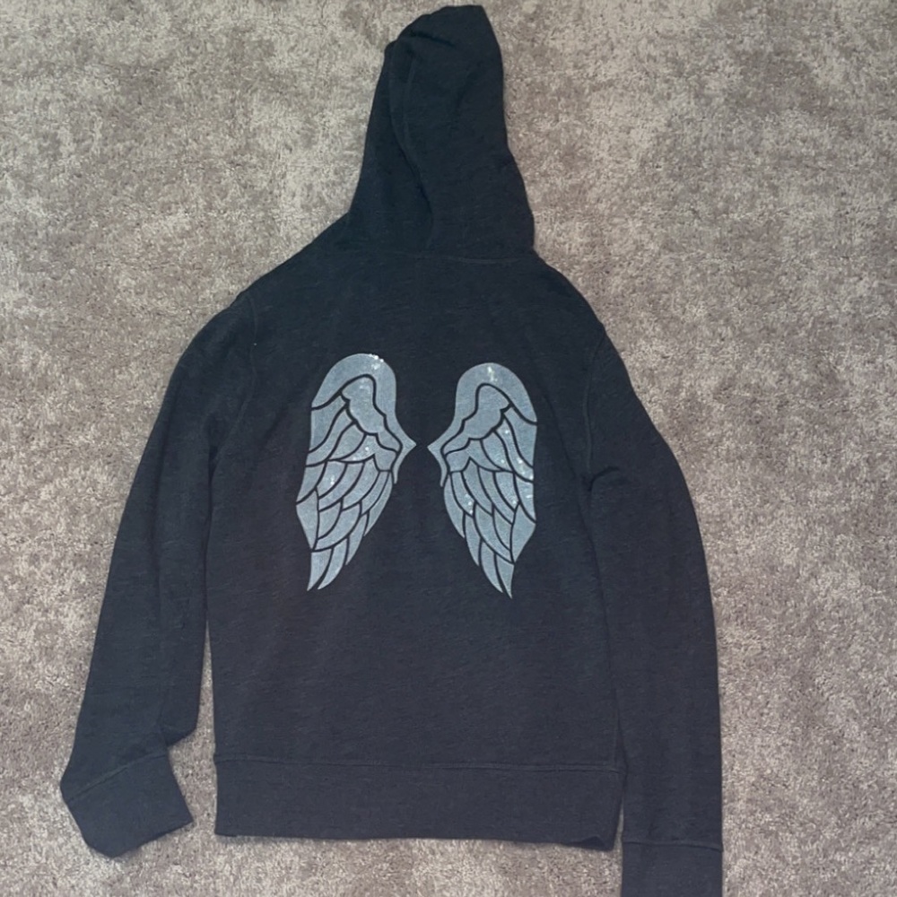 This is a dark gray zip up jacket with sequins